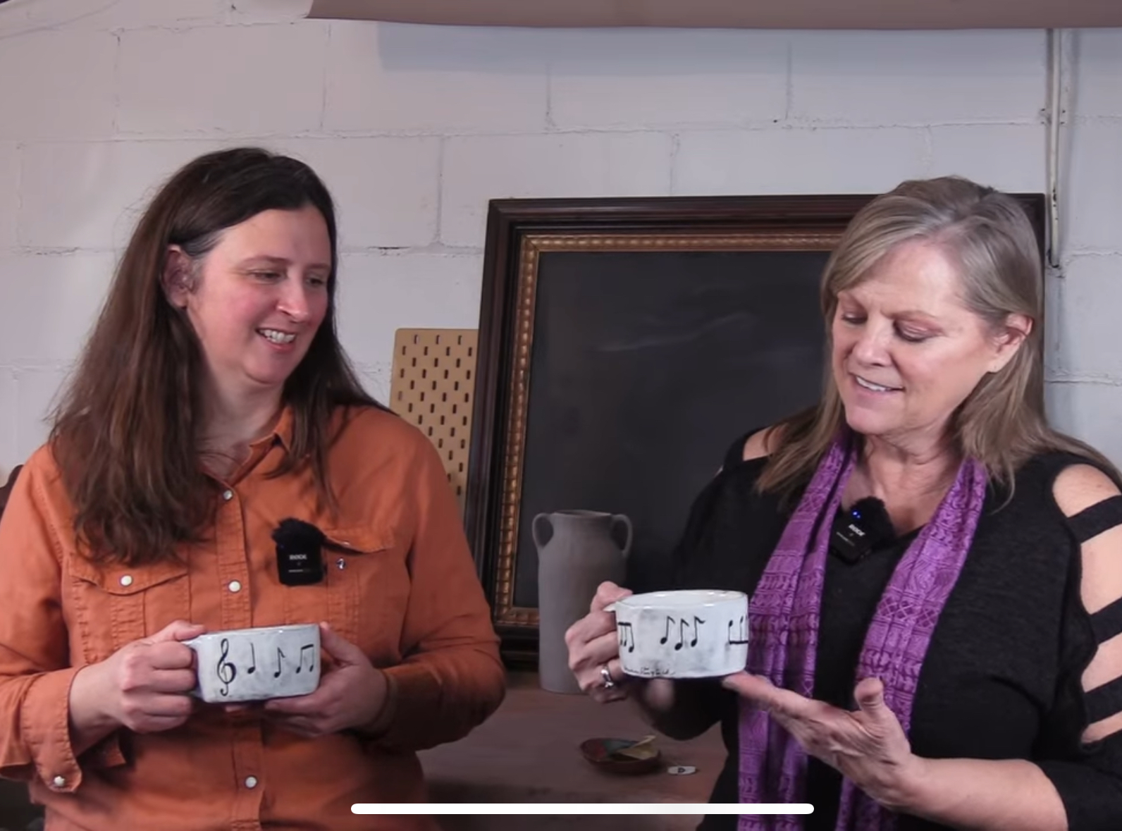 Carlene Hall Productions and a guest holding music-note mugs while recording Main Streets & Backroads